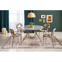 Table de salle à manger ronde avec plateau aspect marbre et structure design en acier doré Break
