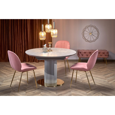 Ambiance salle à manger élégante avec table RAM ronde et chaises velours