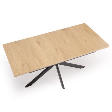 Vue de trois-quarts de la table à manger extensible chêne doré et pieds noirs